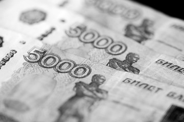 Russian banknotes of five thousand rubles close-up. Monochrome money background