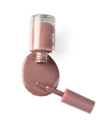Close up of a nail polish puddle over white background