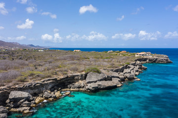 Aerial view of coast of Curaçao in the Caribbean Sea with turquoise water, cliff, beach and...