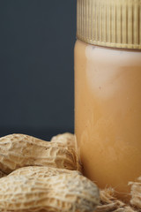 Peanut butter with the peanuts over black background.this peanut also kown as ground nut. selective focus