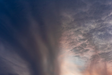 Fototapeta premium Dramatic orange sky with clouds at sunset. It can be used as a background