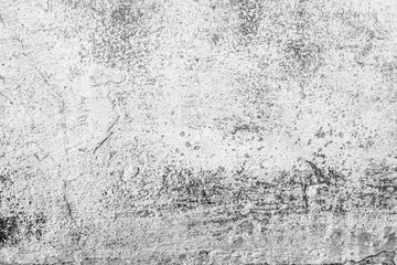 Texture of a concrete wall with cracks and scratches which can be used as a background