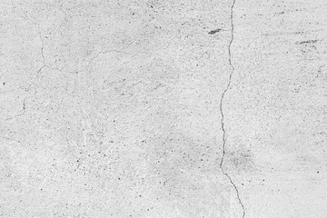 Texture of a concrete wall with cracks and scratches which can be used as a background