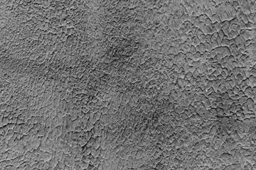 Texture of a concrete wall with cracks and scratches which can be used as a background