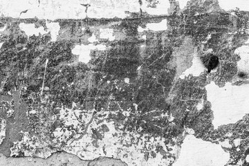 Fototapeta premium Texture of a concrete wall with cracks and scratches which can be used as a background