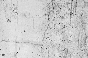Texture of a concrete wall with cracks and scratches which can be used as a background