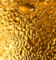Drops of water on a gold background