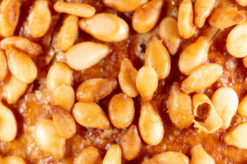 Sesame seeds on a brown crust of bread