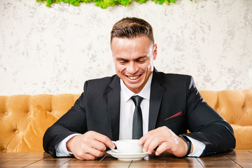 Businessman is negotiating a cup of coffee