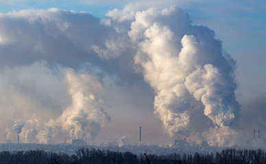 Smoke from the chimneys of a metallurgical plant at dawn