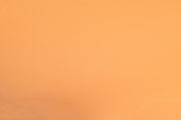 Seamless texture of the golden sand 