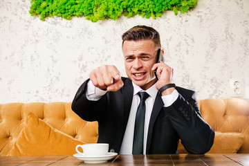 Businessman is negotiating a cup of coffee