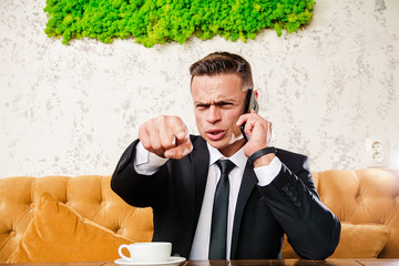 Businessman is negotiating a cup of coffee