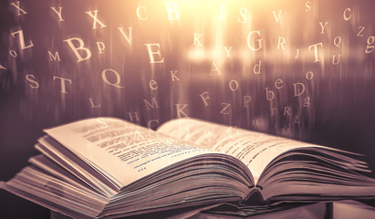 Imagine opening an old book blurred with magic power on the table and the English alphabet floating...