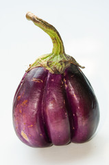 Macro side view of eggplant on white background