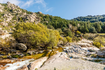 River in La Pedriza, in the mountains of Madrid, area characterized by large granite rocks