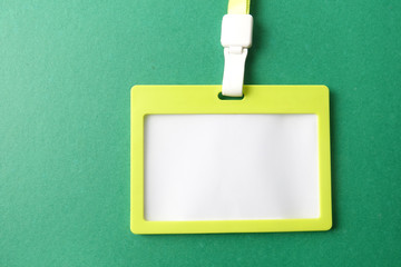 Empty ID card isolated on green background.