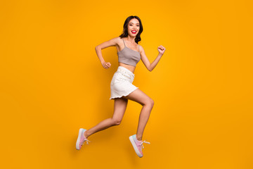 Fototapeta na wymiar Profile side full length body size photo of cheerful cute pretty nice girlfriend smile toothy running jumping toothy isolated vivid color background