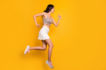 Fototapeta na wymiar Side profile full length body size photo of cheerful positive cute pretty nice girlfriend running towards jumping sales isolated vivid color background