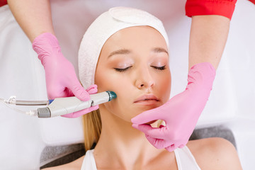 Vacuum hydropiling treatment by the woman in SPA center