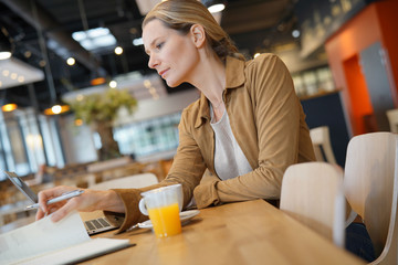 young businesswoman in a cafeteria