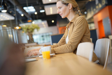 young businesswoman in a cafeteria