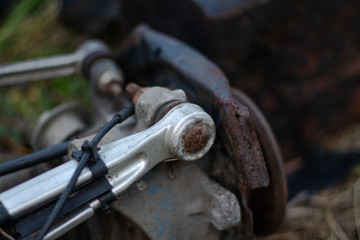 aluminum suspension arm of an old car
