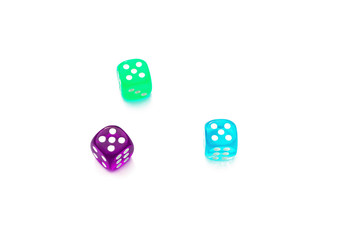 number five on the edges of the die, three multi-colored dice on white background