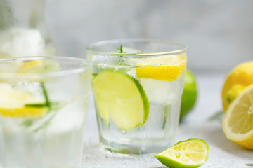 Lime and lemon mojito cocktails, fresh summer drink with ice and rosemary