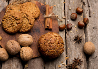 whole grain cookies spices on wooden background