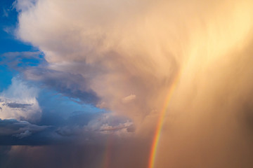 Fototapeta na wymiar Beautiful sky with Cumulus clouds, rainbow after a thunderstorm,