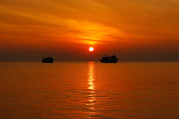 summer. Beautiful natural background of sunset with 2 boat on vacation