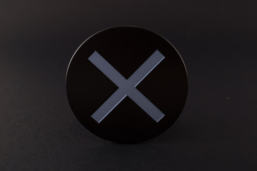 Multicolor objects, circle, triangle, square and letter X on a black background