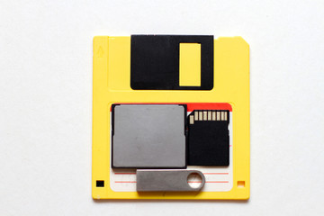 Flash drives, memory card and floppy disk. Row of rious types of data storage. 