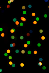 Multicolored abstract bokeh on black background