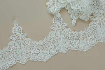 Texture lace fabric. lace on white background studio. thin fabric made of yarn or thread. a...