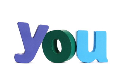 Colorful wooden alphabet letters spelling out word you isolated on white background