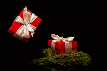 Gift box with white ribbon on black background. zero gravity. levitation. milimalism. Concept...
