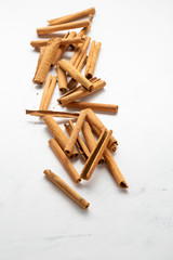 Cinnamons stick on white wooden background