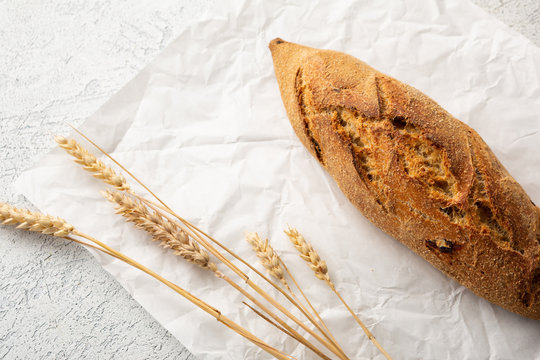 Cereal loaf of bread and wheat, food background