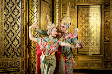 The character Phra and Nang dancing in a Thai pantomime performance.
