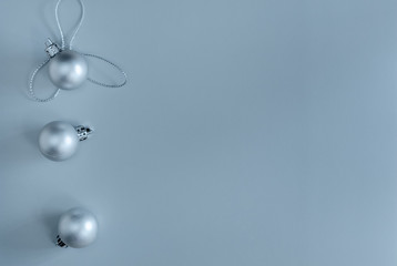 Christmas composition silver christmas balls on gray background. Flat lay. New Year. Top view, minimalism, copy space, postcard.