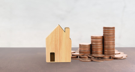 Coin stack house model savings plans for housing,home and Real Estate concept