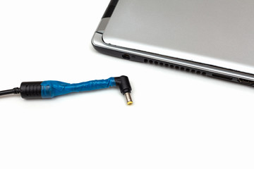 broken laptop power adapter.