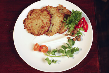 Grilled chicken breast. Grilled chicken fillet and salad of fresh vegetables from tomatoes, cucumbers and arugula leaves. Chicken meat salad. Healthy food. The apartment was lying. View from above.