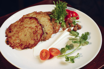 Grilled chicken breast. Grilled chicken fillet and salad of fresh vegetables from tomatoes, cucumbers and arugula leaves. Chicken meat salad. Healthy food. The apartment was lying. View from above.