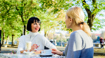 True friendship friendly close relations. Conversation of two women cafe terrace. Friendship meeting. Togetherness female friendship. Trustful communication. Girls friends drink coffee and enjoy talk