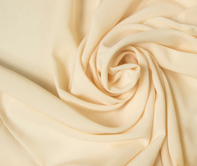Abstract folds. Delicate silk drapery. Beige color.