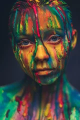 Gartenposter Young woman covered with a colourful paint © Nejron Photo