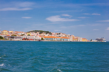 Fototapeta na wymiar Lisbon on the Tagus river bank, central Portugal. Tajo view from the ferry to Almada.